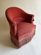 Fauteuil crapaud en velours rose-orangé