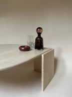 Table basse oeil en travertin