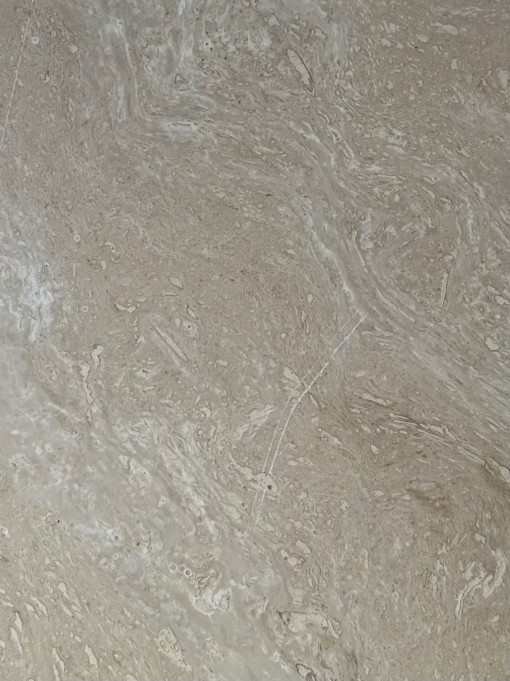 Table basse oeil en travertin