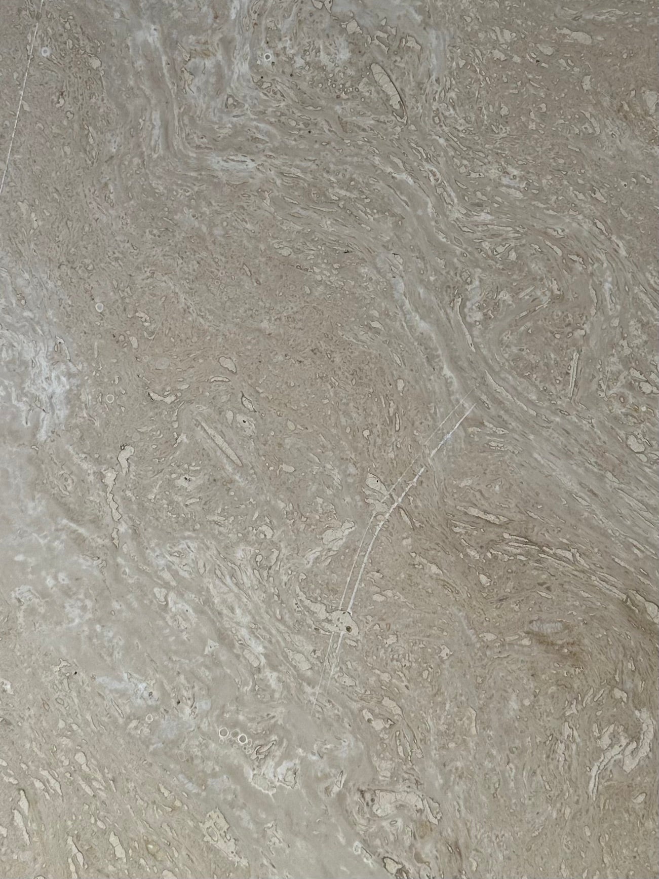 Table basse oeil en travertin