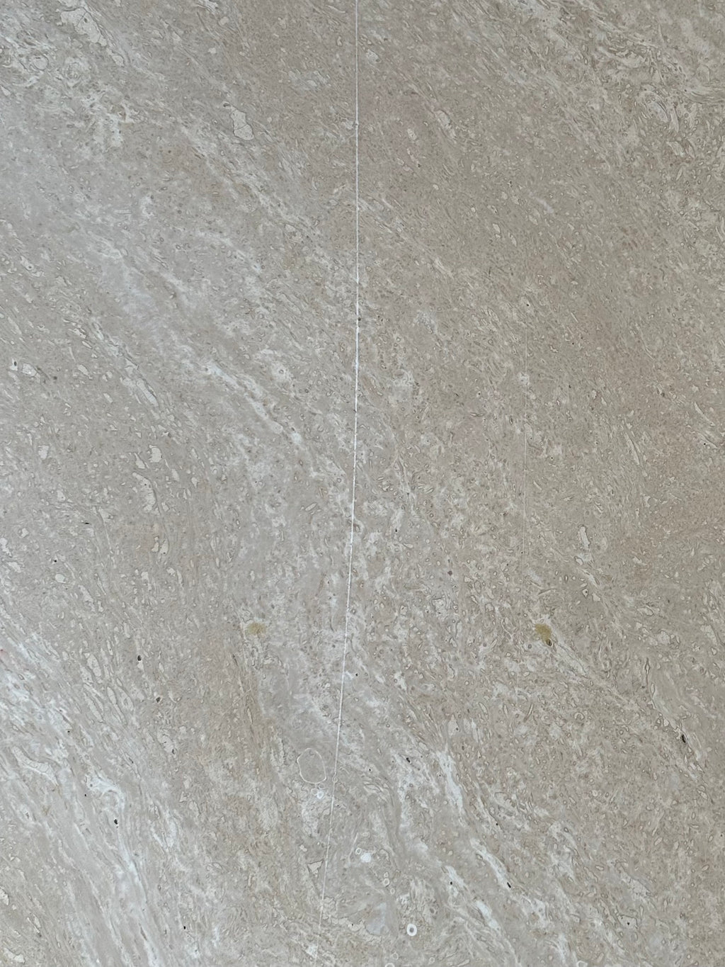 Table basse oeil en travertin